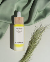 Henua Organics The Pause bio-retinol serum on green bakground